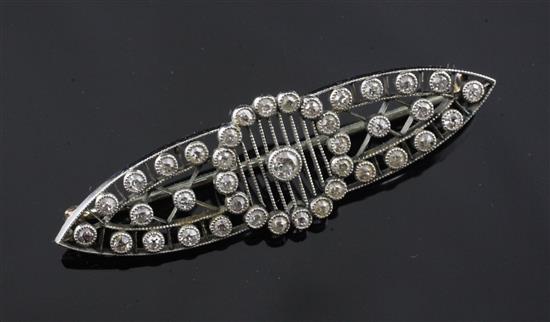 A Belle Epoque platinum, gold and millegrain set diamond openwork brooch, 1.75.